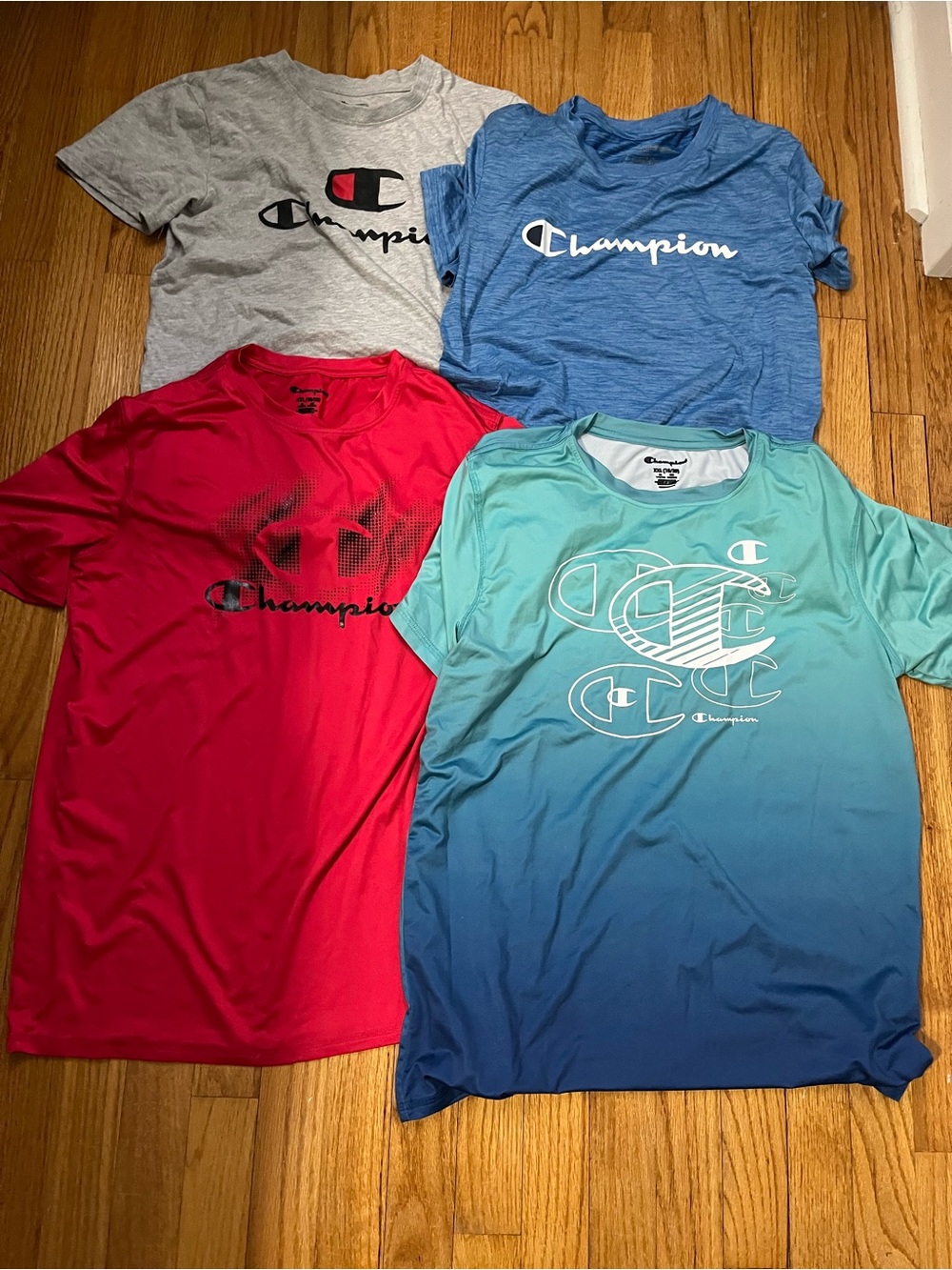 Champion Four-Pack Logo T-Shirts in Gray, Blue, Red, Teal
